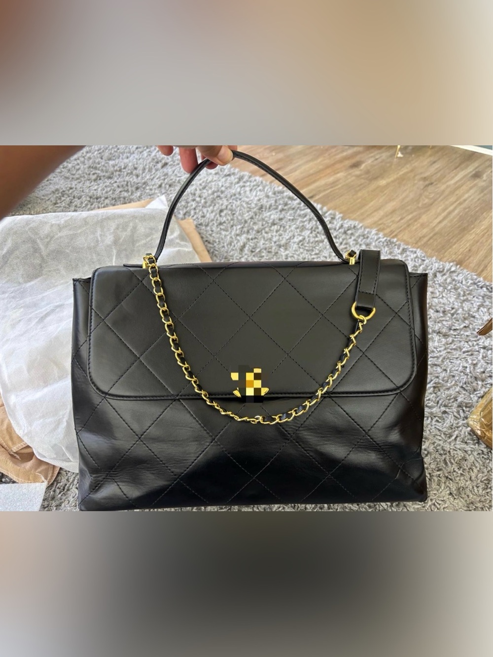 Black Quilted Shoulder Bag with Gold Chain and Top Handle